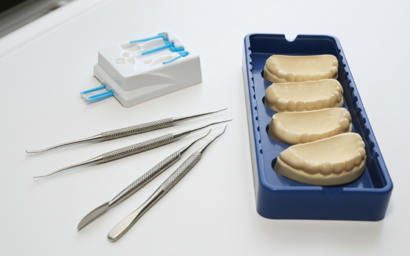 Retraction cords and dental impression materials