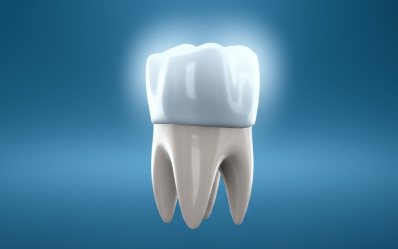 Porcelain dental crown floating above prepared tooth