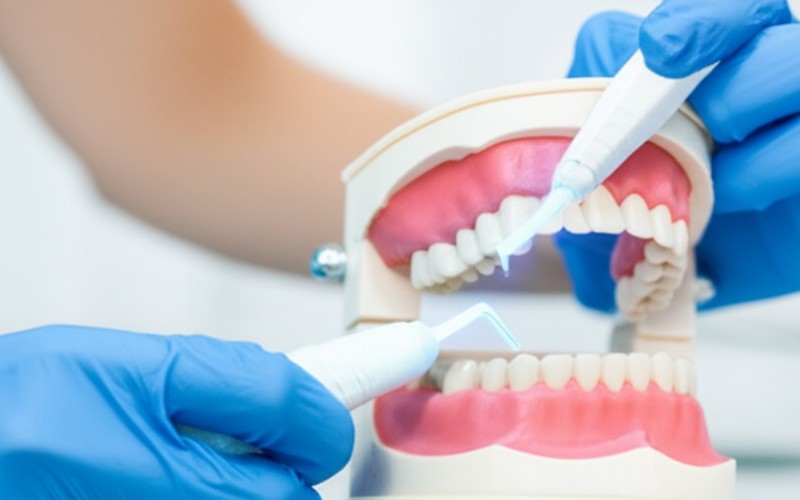 Dentist using modern dental tool
