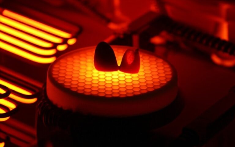 Glowing metal crown in furnace