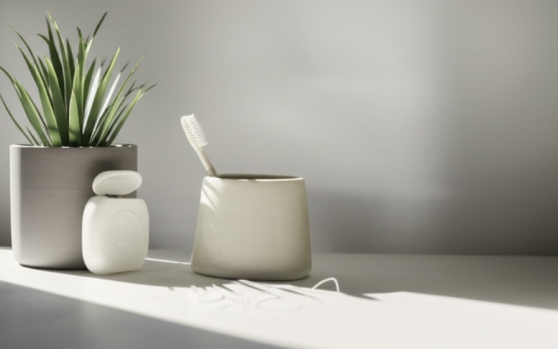 Toothbrush and floss on a counter