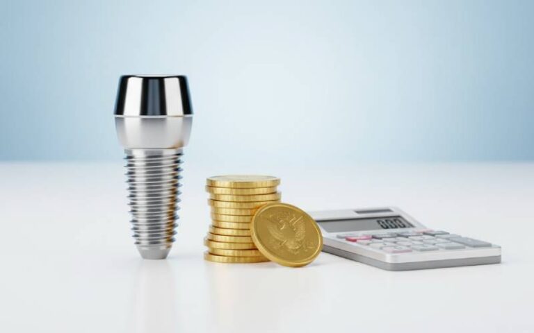 Dental implant model with coins and calculator